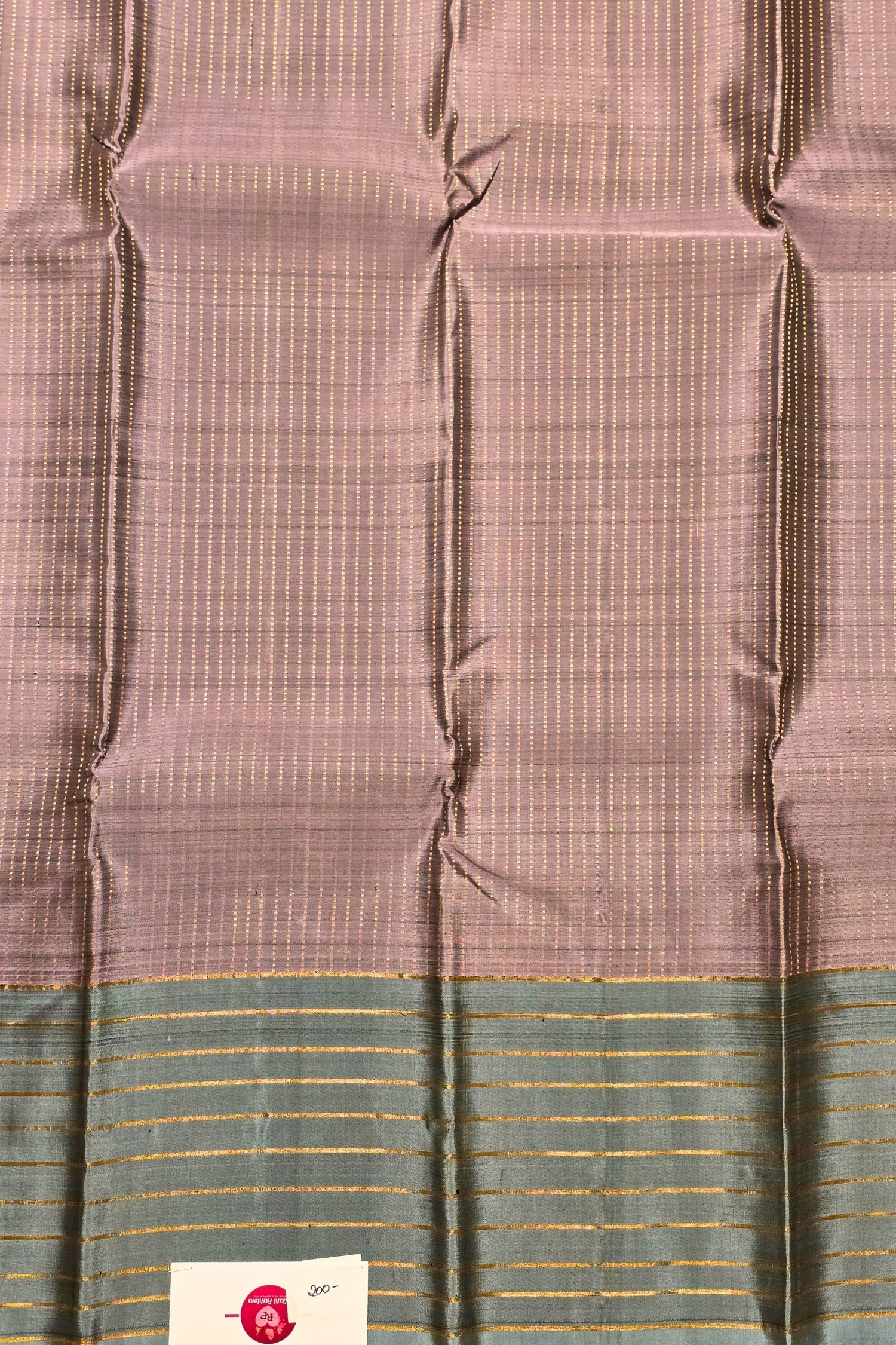 Fabric with a checkered pattern and a brand label in the corner