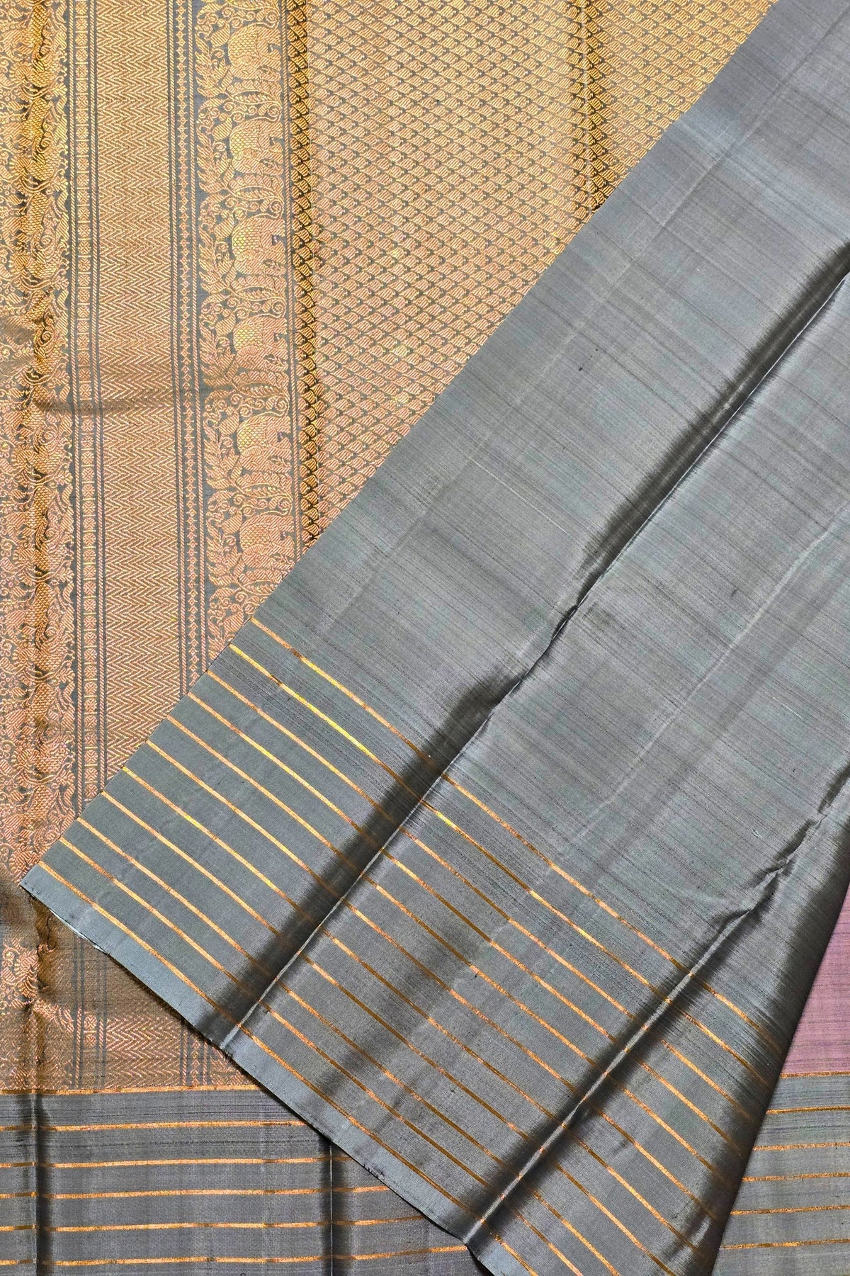 Gray fabric with gold stripes on a textured background