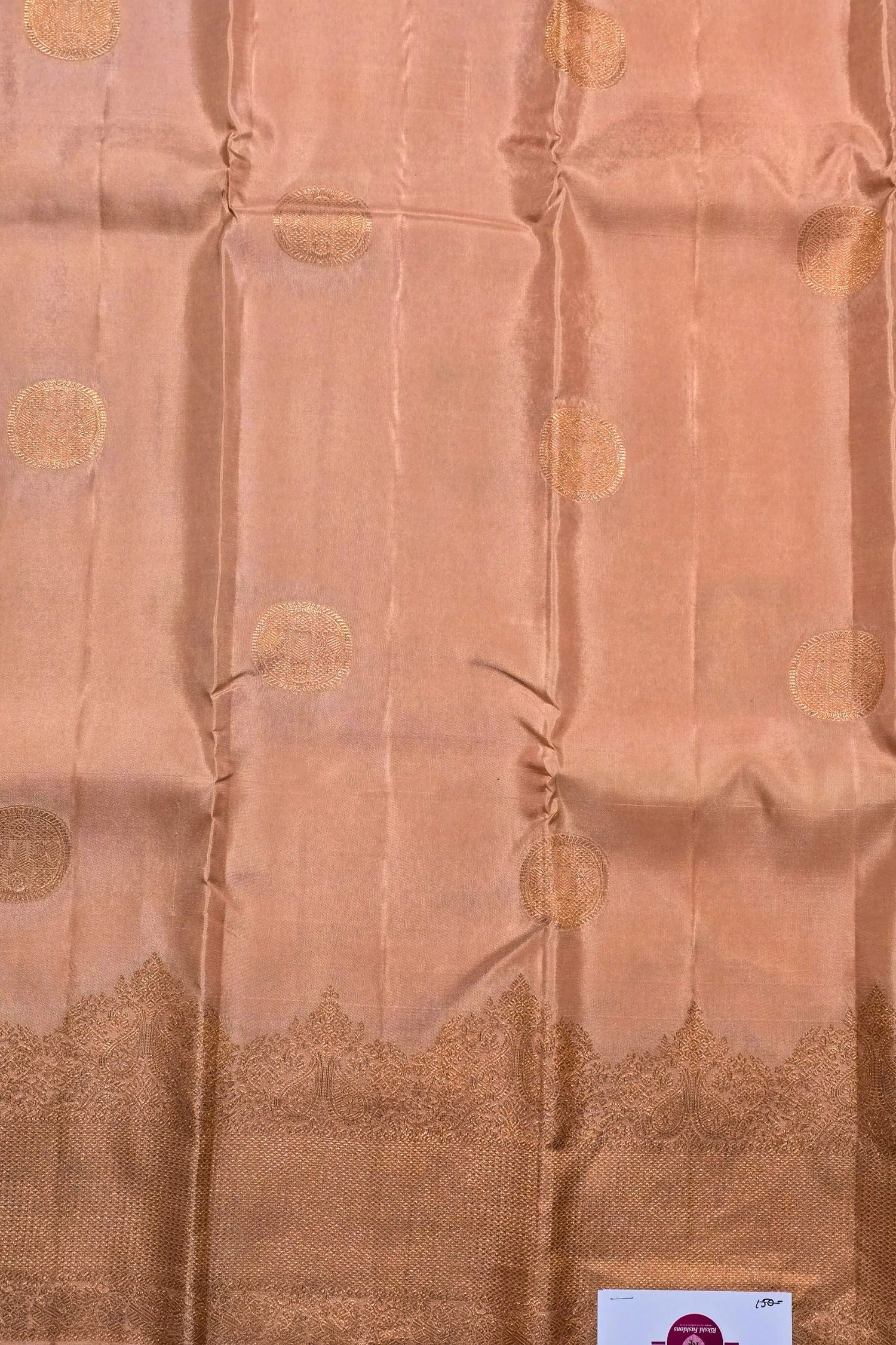 Brown fabric with gold circular patterns