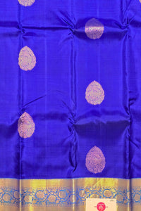 Blue fabric with gold and white patterns