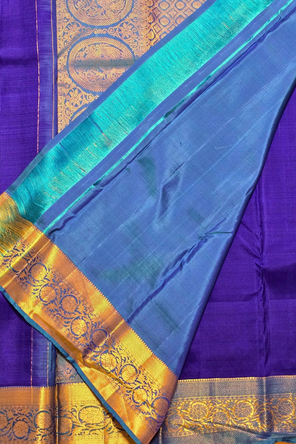 Blue and purple saree with gold border