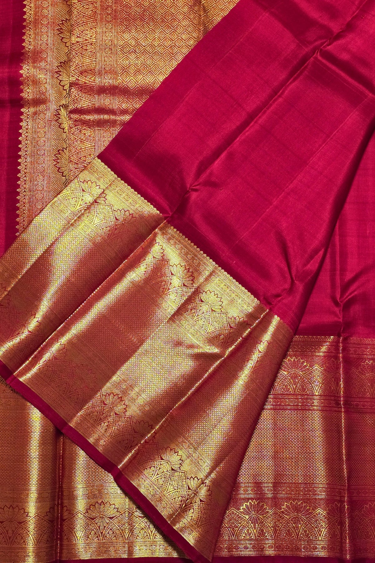 Red and gold traditional fabric with intricate patterns