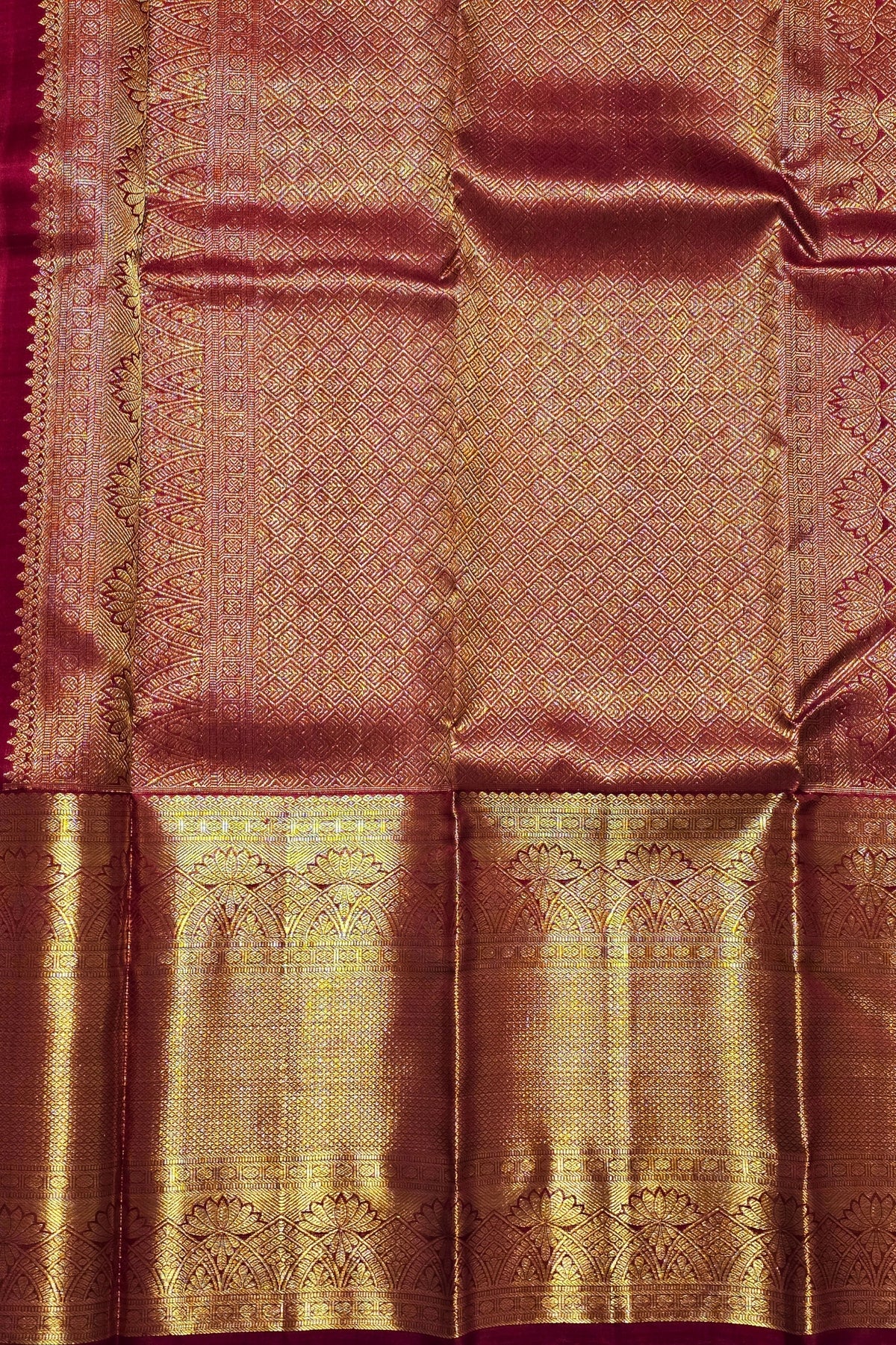 Silk saree with intricate patterns and a border