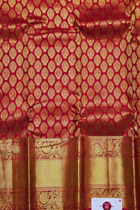Red fabric with gold pattern and border