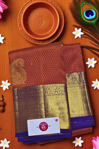 Traditional saree with a card on a wooden surface with decorative elements