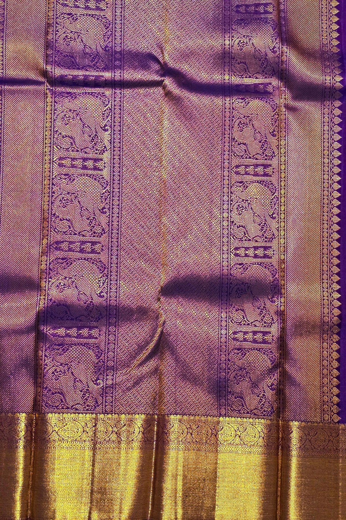 Purple and gold fabric with intricate patterns