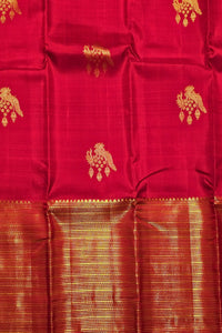 Red fabric with gold patterns and border