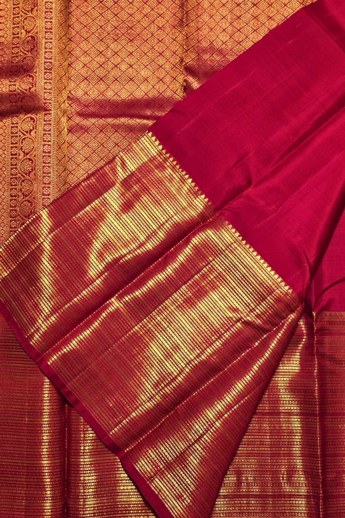 Red and gold traditional fabric with intricate patterns