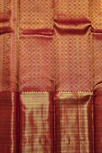 Close-up of a maroon fabric with gold border and intricate patterns