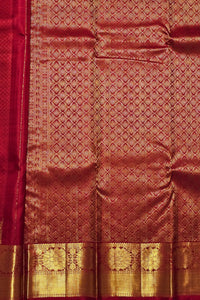 Red fabric with gold geometric pattern