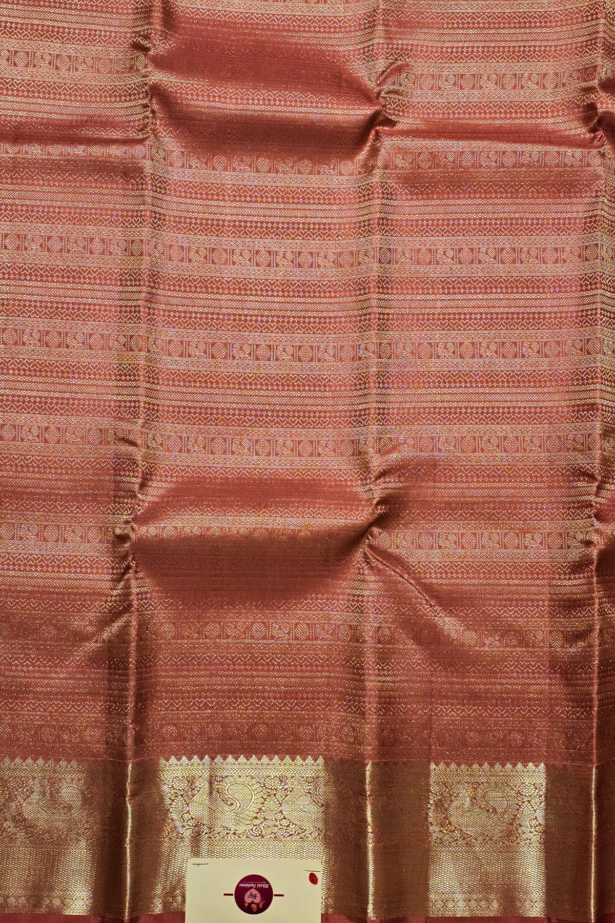 Patterned fabric with a visible brand label in the corner