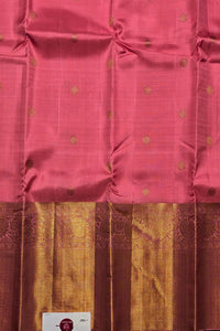Pink saree with gold border and patterns