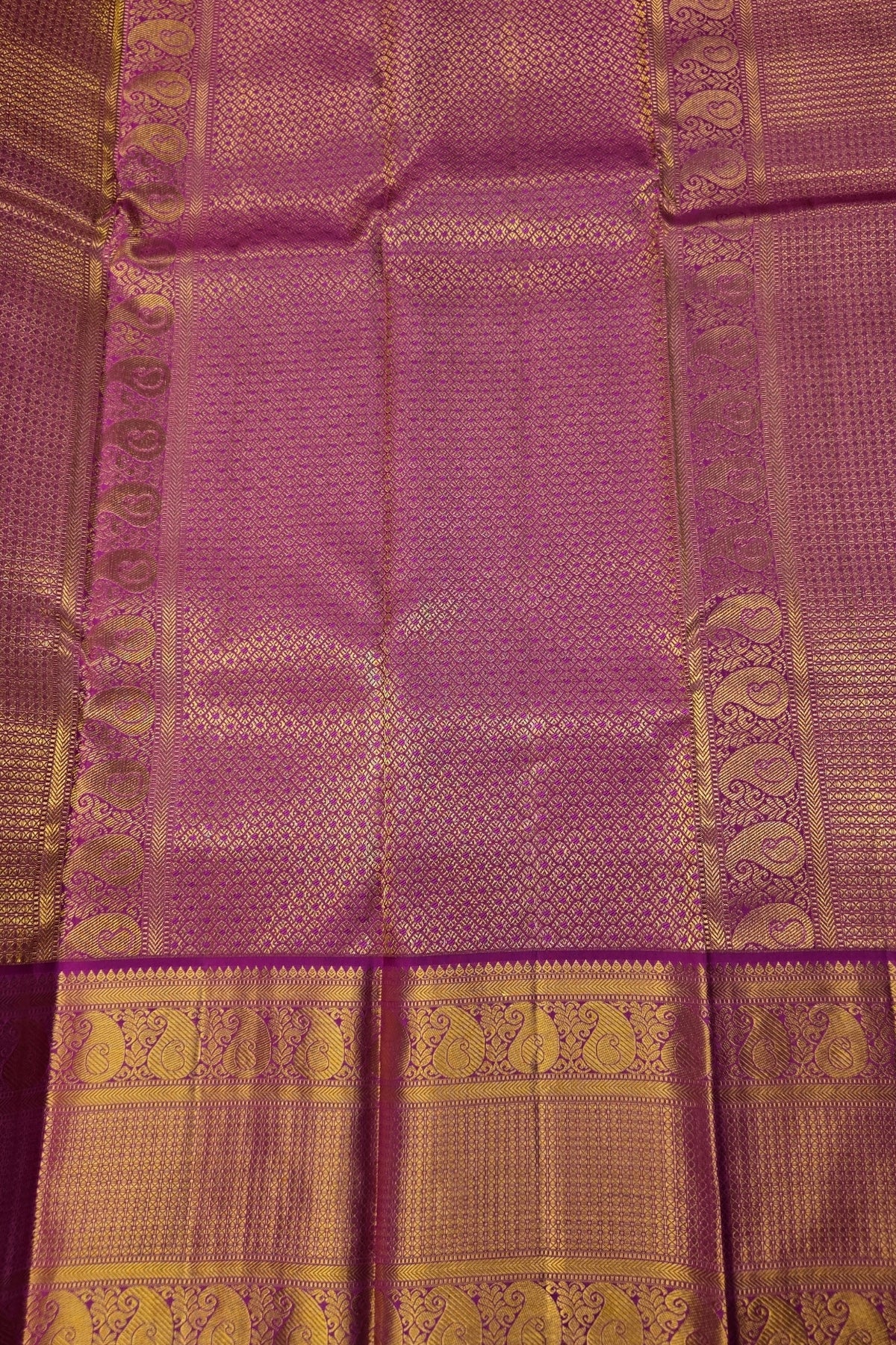 Purple fabric with gold patterns and border