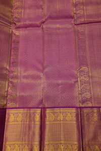 Purple fabric with gold patterns and border