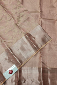 Brown fabric with a subtle pattern and a visible brand label.