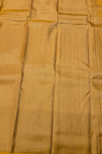 Close-up of gold fabric with a subtle pattern