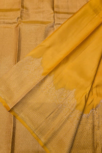 Close-up of a yellow fabric with intricate patterns