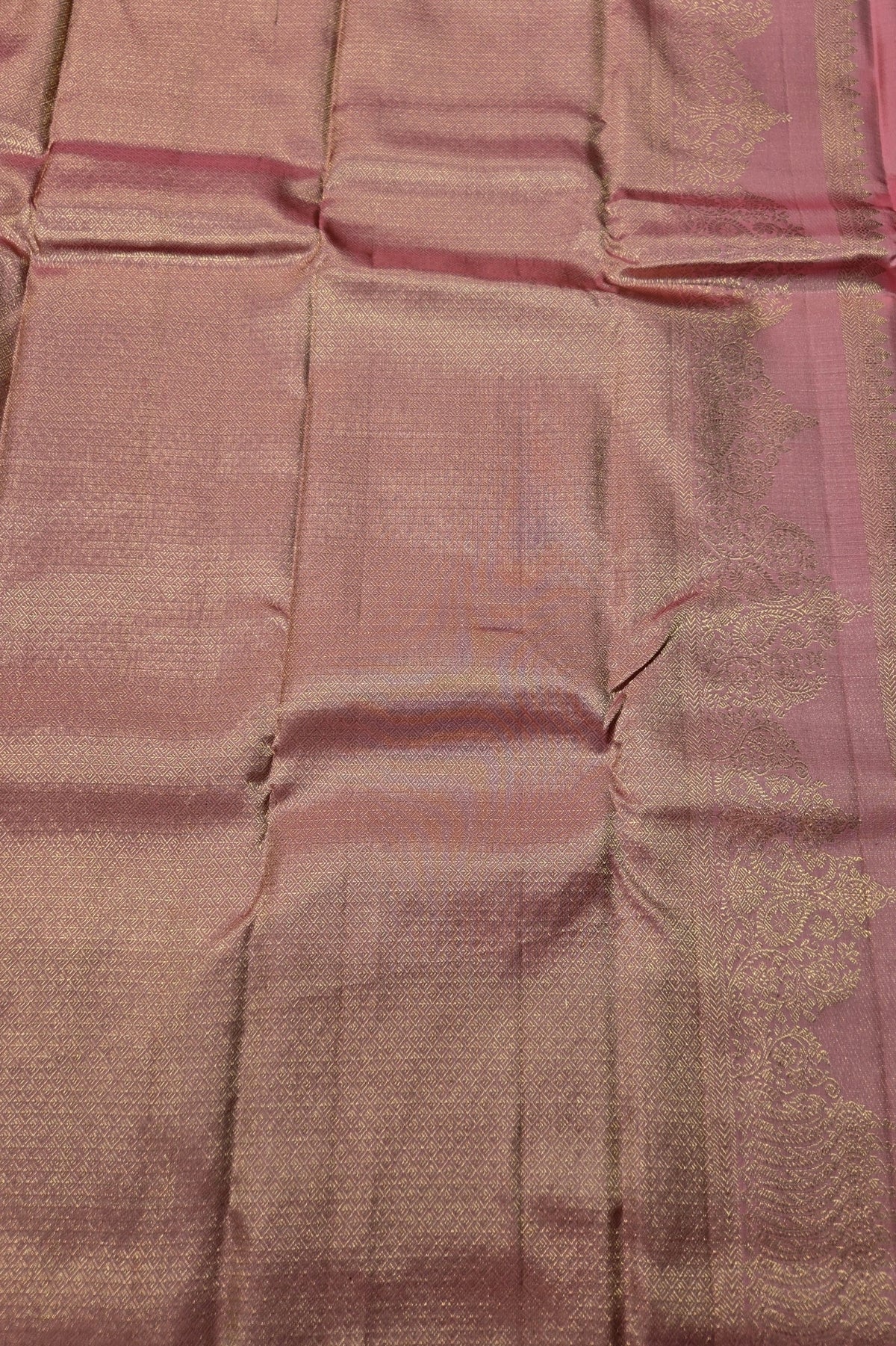 Close-up of a pink and purple fabric with a subtle pattern