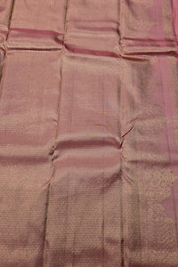 Close-up of a pink and purple fabric with a subtle pattern