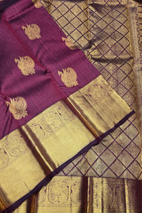 Purple and gold traditional fabric with intricate patterns