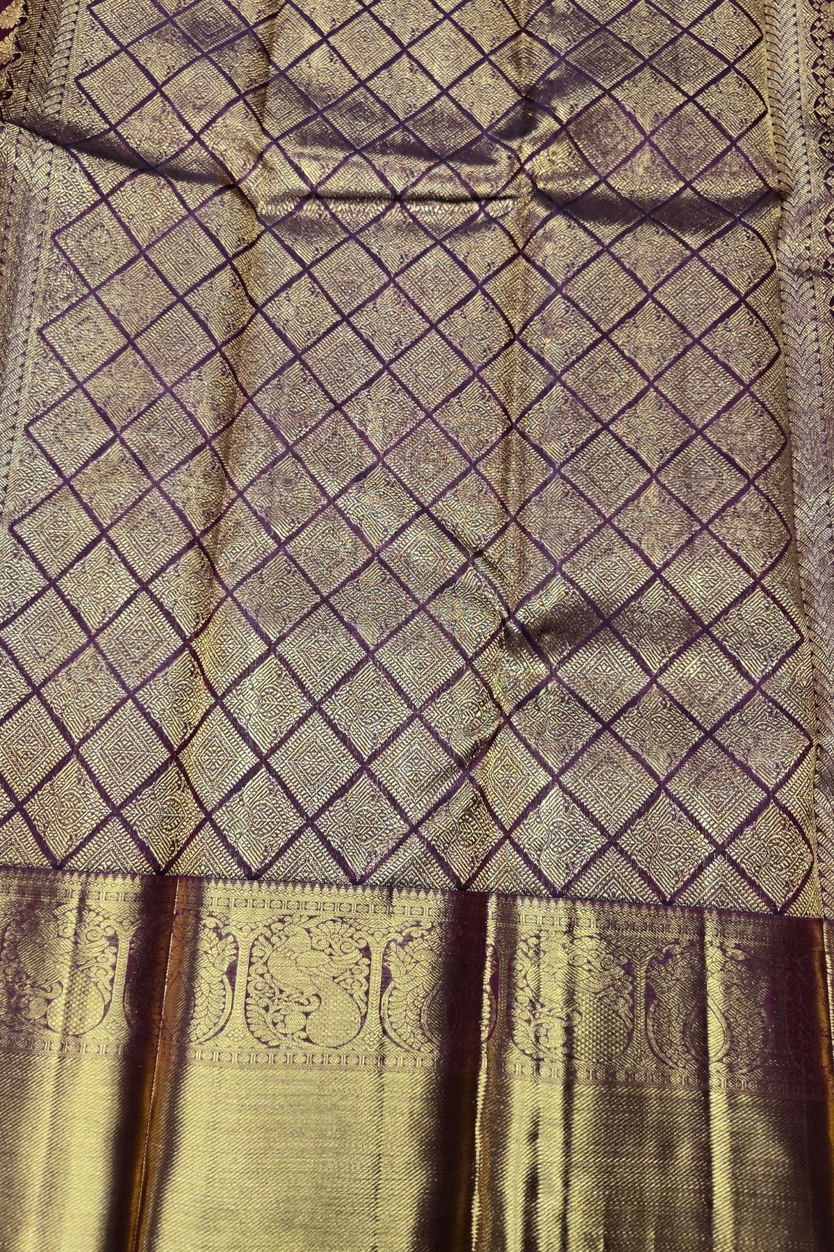 Textured fabric with diamond pattern and gold border