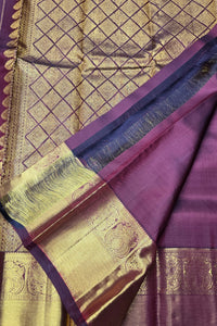 Purple and gold traditional fabric with intricate patterns