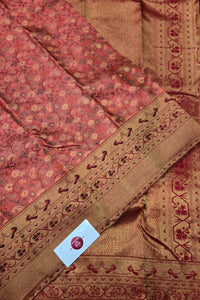 Close-up of a fabric with intricate patterns and a visible brand label.
