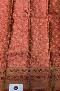 Traditional pink and brown fabric with intricate patterns