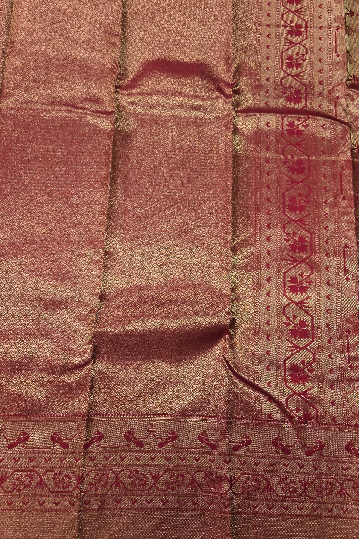 Close-up of a maroon fabric with intricate patterns