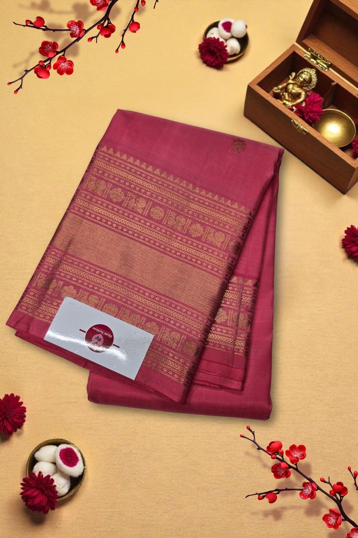 Maroon saree with gold patterns on a beige background with decorative elements