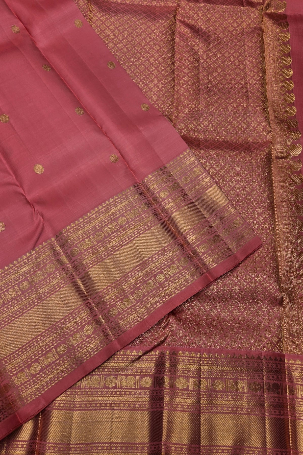 Pink saree with gold patterns