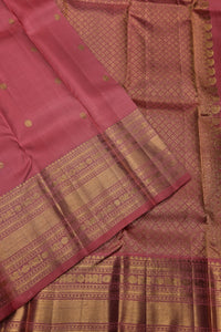 Pink saree with gold patterns