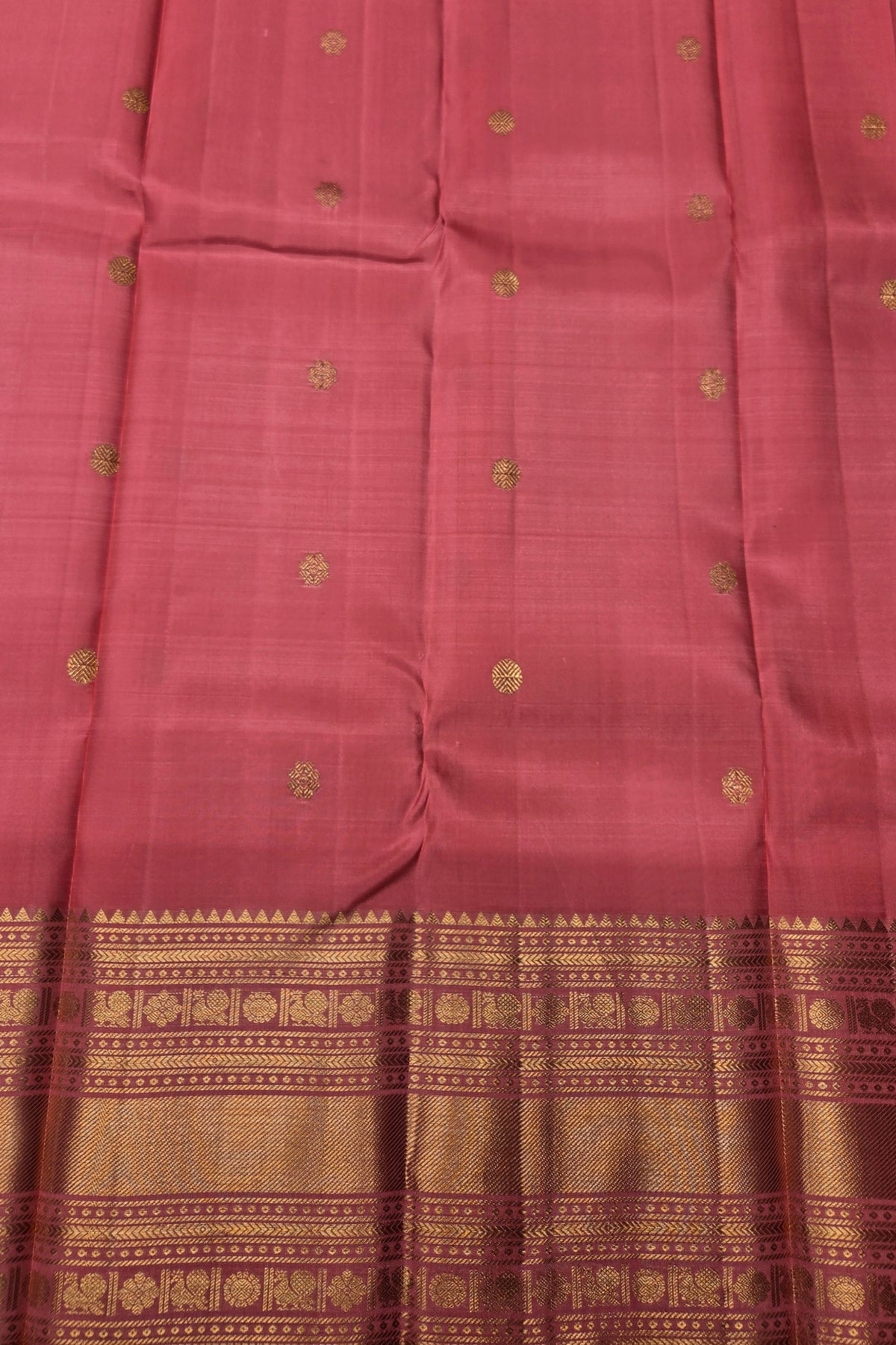 Pink saree with gold patterns