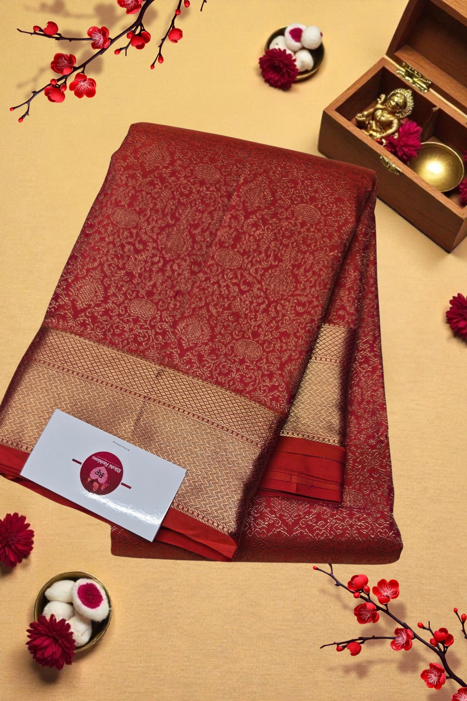 Red and beige folded fabric with a card on a decorative background