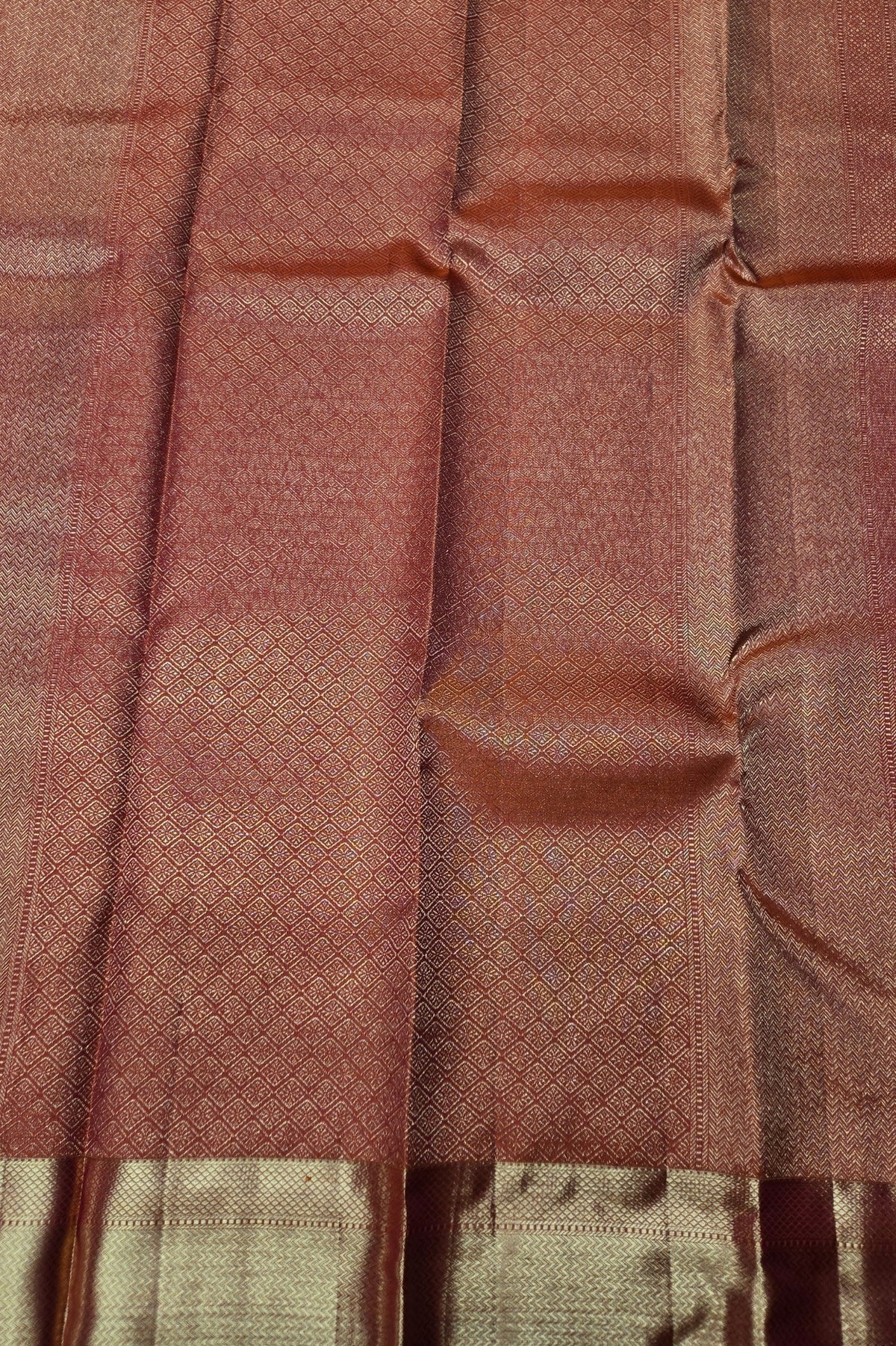 Close-up of brown fabric with a subtle pattern