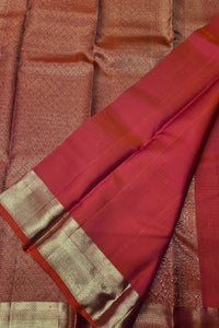 Red and gold traditional fabric with a textured pattern