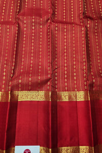 Red fabric with gold patterns and border