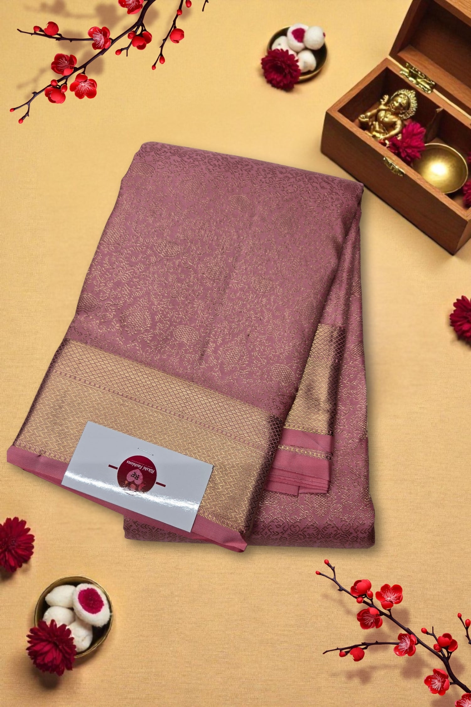 Pink and beige saree with a decorative setting on a beige background