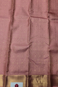 Close-up of a maroon fabric with a gold border