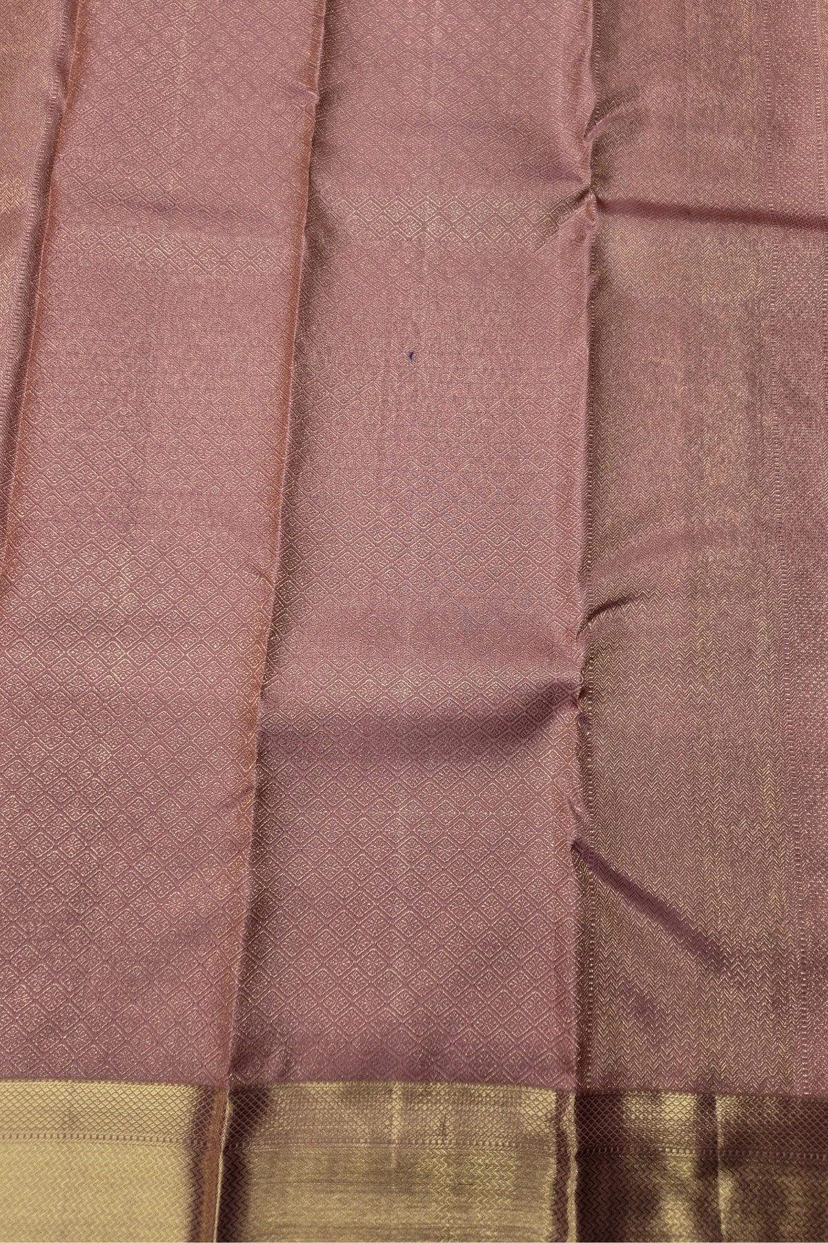 Close-up of a brown fabric with a subtle pattern
