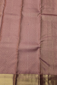Close-up of a brown fabric with a subtle pattern