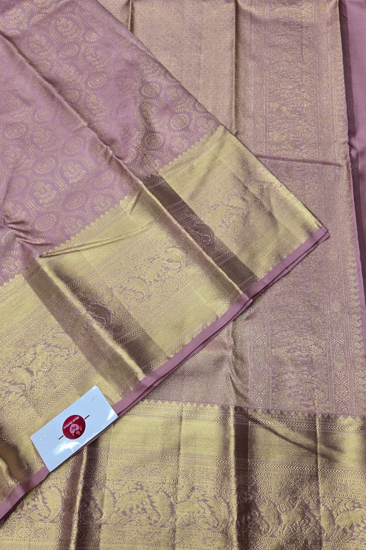 Saree with a checkered pattern and a visible brand label.