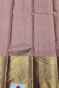 Silk saree with a pink and gold patterned design