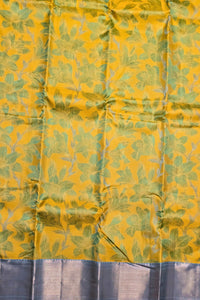 Yellow fabric with green leaf pattern