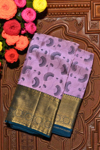 Pink saree with gold border on a decorative background