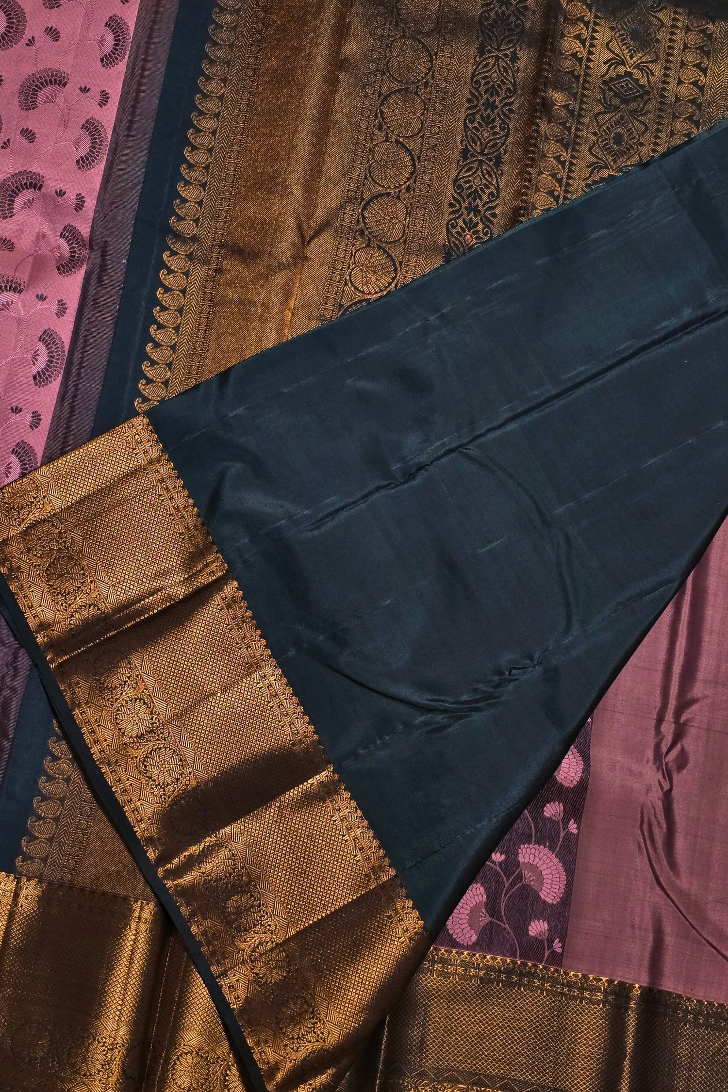 Close-up of a patterned fabric with gold, brown, and blue colors.