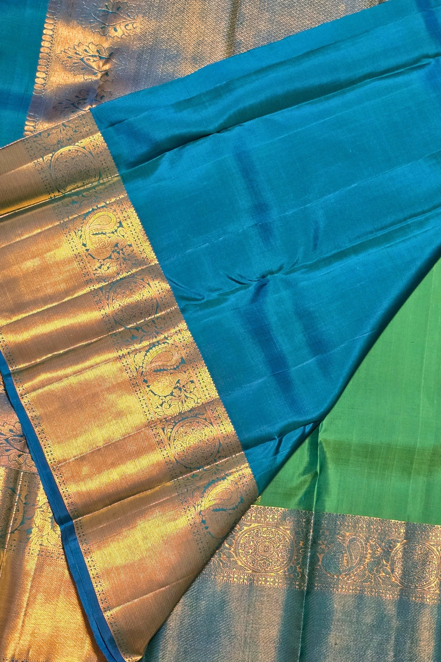 Sari with blue and green fabric and gold border