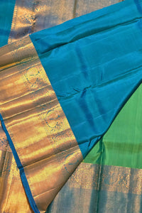 Sari with blue and green fabric and gold border