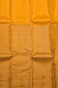 Close-up of a mustard yellow fabric with a subtle pattern