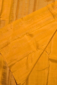 Close-up of a yellow fabric with a subtle pattern